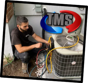 Professional HVAC technician performing maintenance on residential air conditioning system outdoor unit.